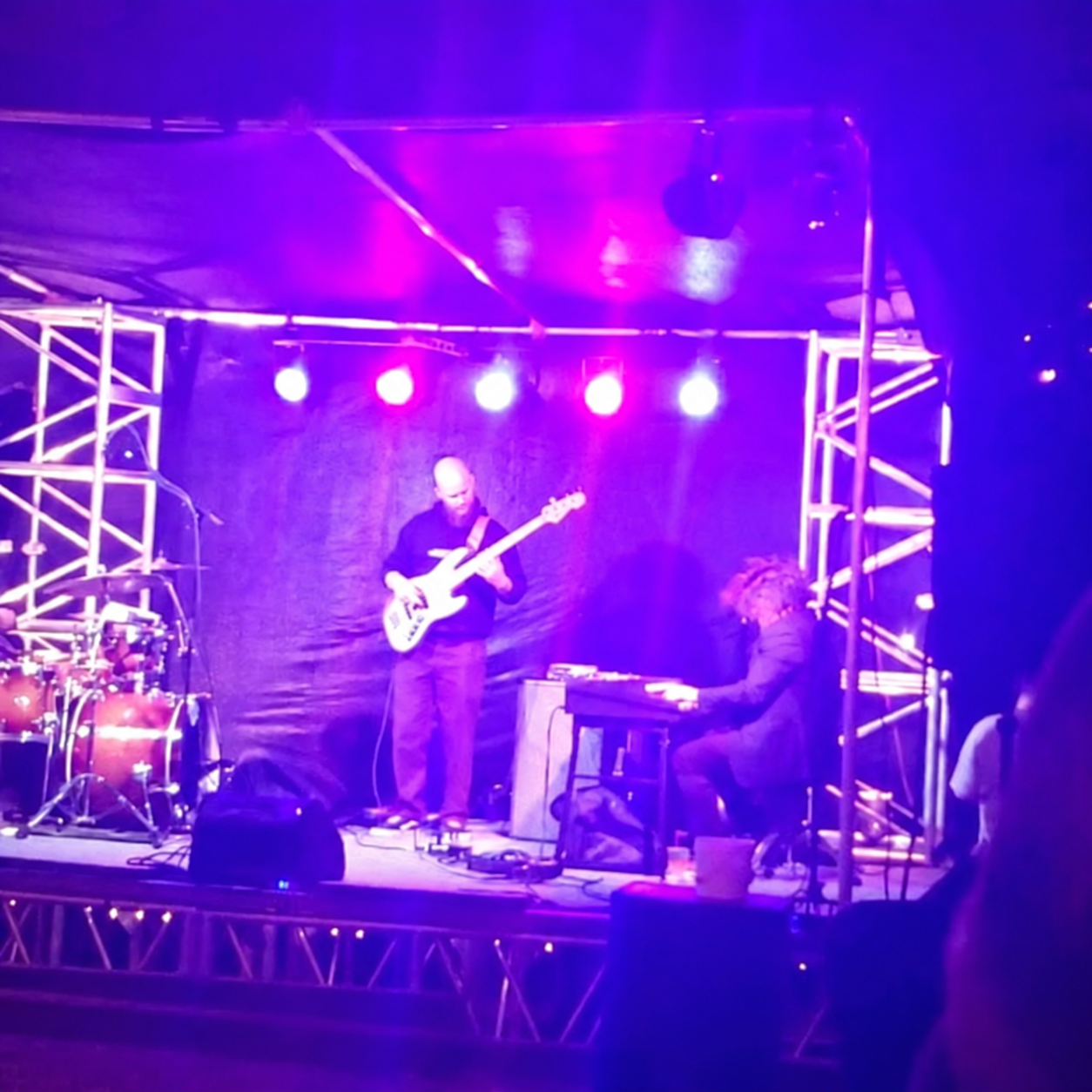 Bass player, keyboard player and drummer performing live at Jazz on the Hill at Cliff’s Café